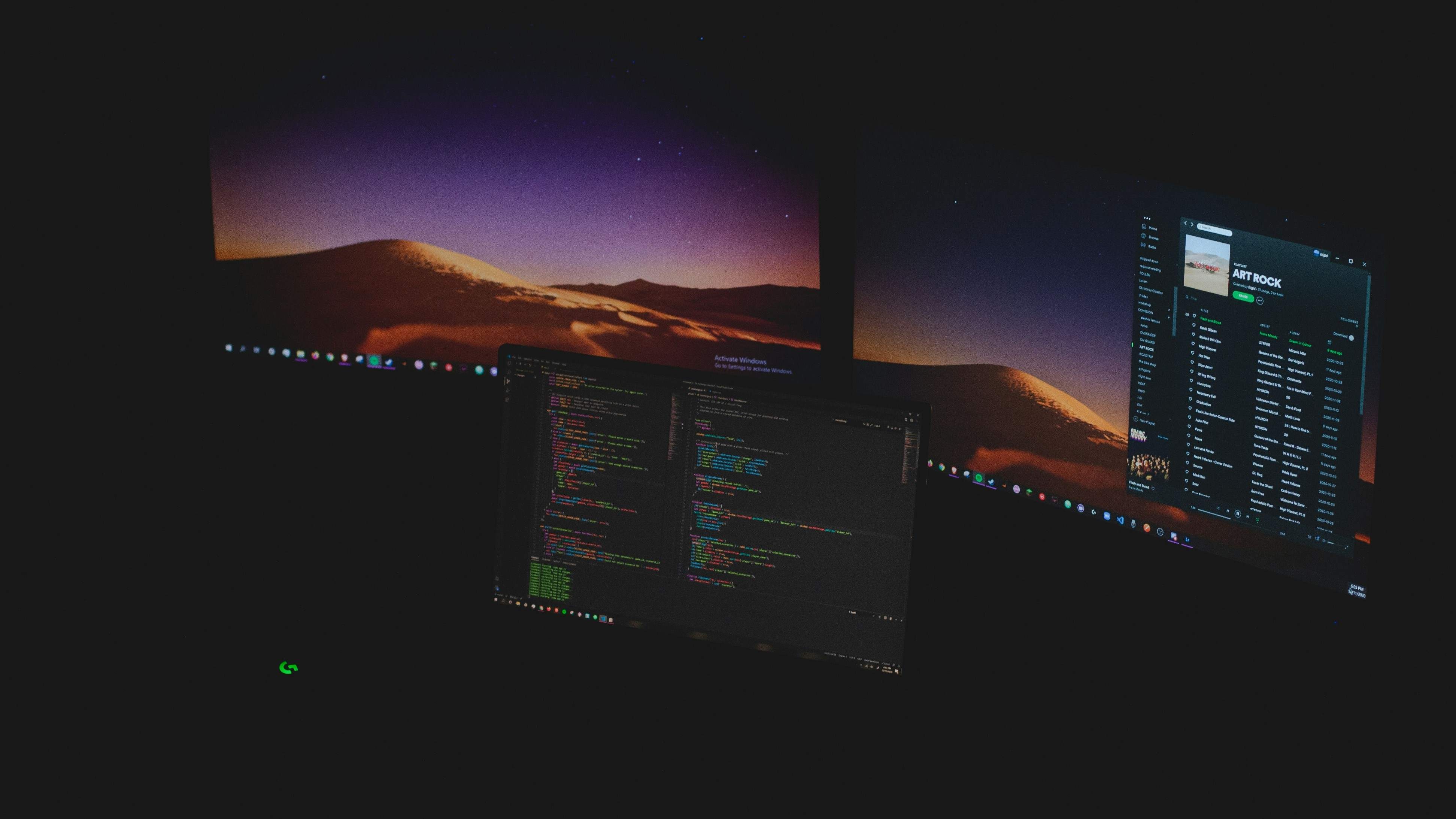 Code on screen — a keyboard and editor in warm, low light